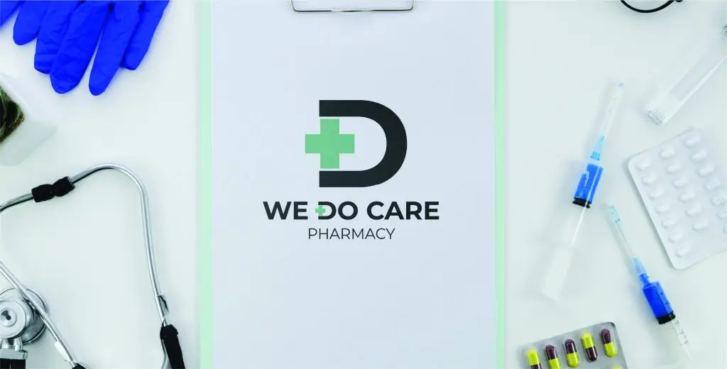 A clean and professional branding concept for a pharmacy. The logo features a bold "D" with a green cross, symbolizing care and expertise. The logo is placed on a clipboard surrounded by medical tools like a stethoscope, gloves, syringes, and medication. This visual composition conveys a strong message of reliability and patient-centered care.